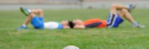 Two kids laying on a Chanhassen, MN soccer field