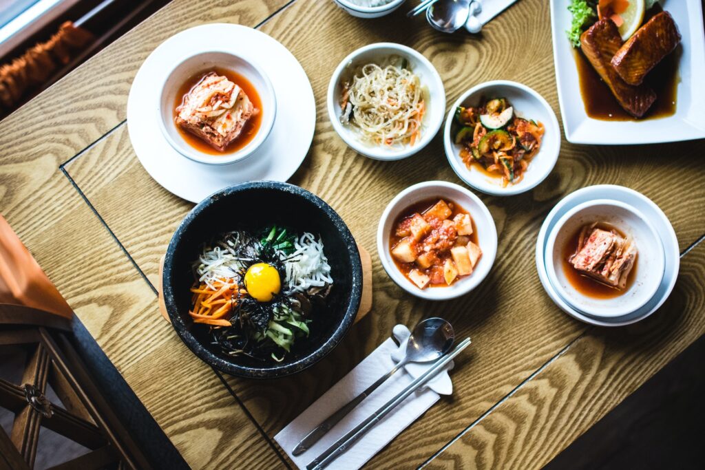A display of Korean food including BiBimBap and Kimchi on a table in Chanhassen, MN