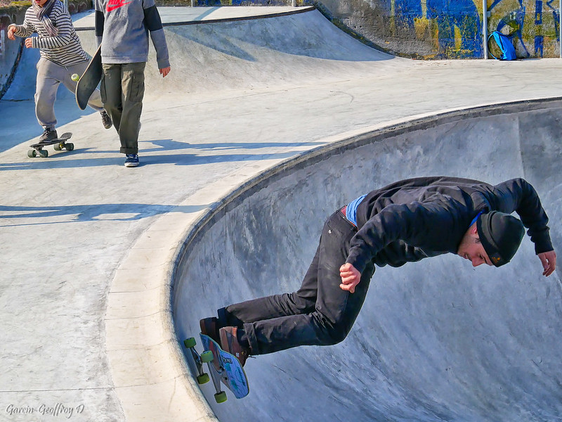 A man skateboarding in a half-pipe at a skate park in Woodbridge, VA