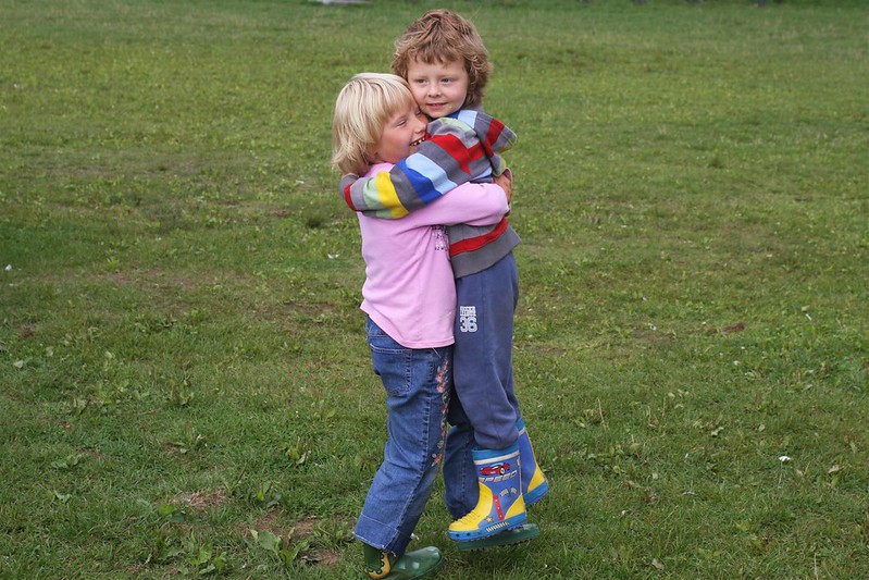 Two children hugging in a field at a local camp in Mount Laurel, NJ