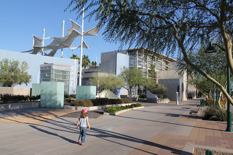 A child walking outside of the Mesa Arts Center in Mesa, AZ