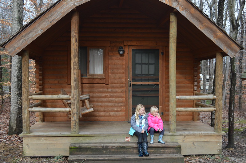 Two small girls sitting on the steps of a cabin at Pohick Bay Regional Park in Port Potomac, VA.