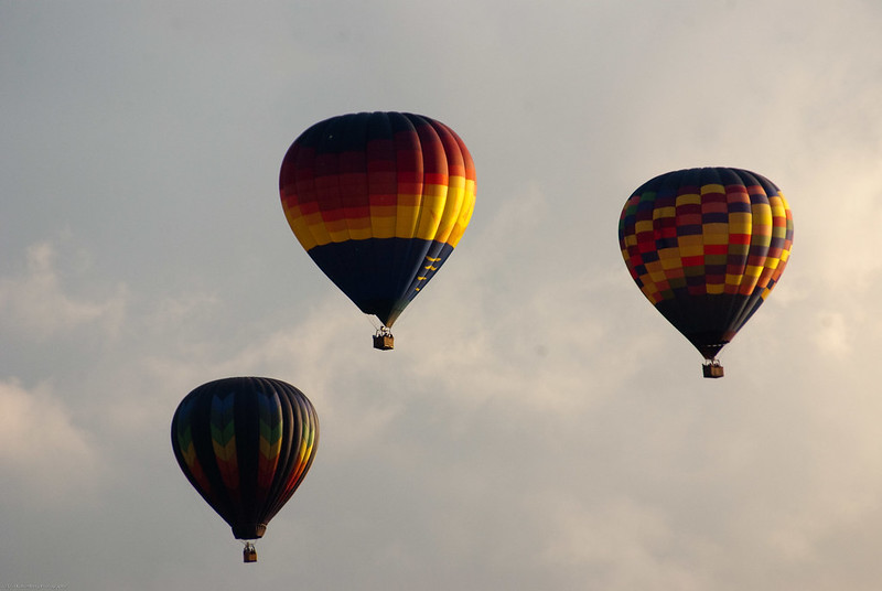 Three hot air balloons in the sky over Ohio