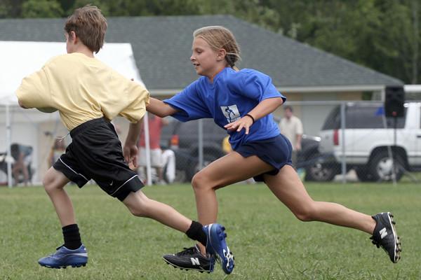Two young girls playing flag football in East Cobb,GA