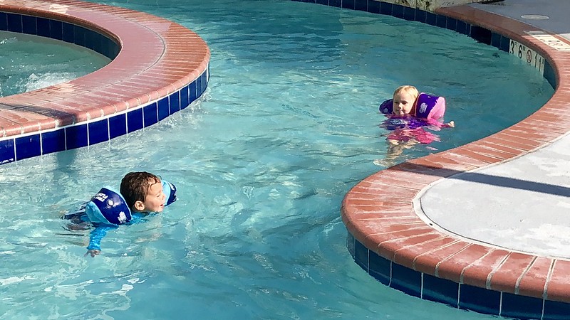 Two children wearing water wings in a pool near Westerville, OH