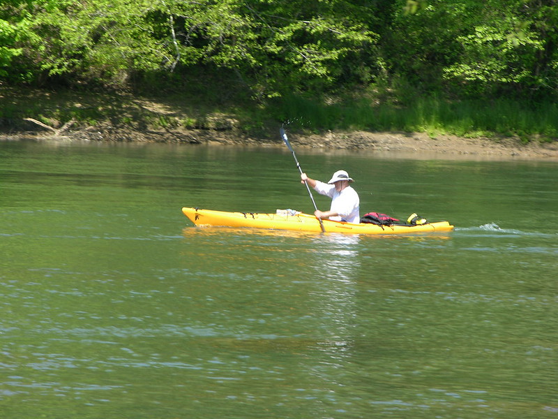 Man in a kayak paddling down the Chattahoochee River near Duluth, GA