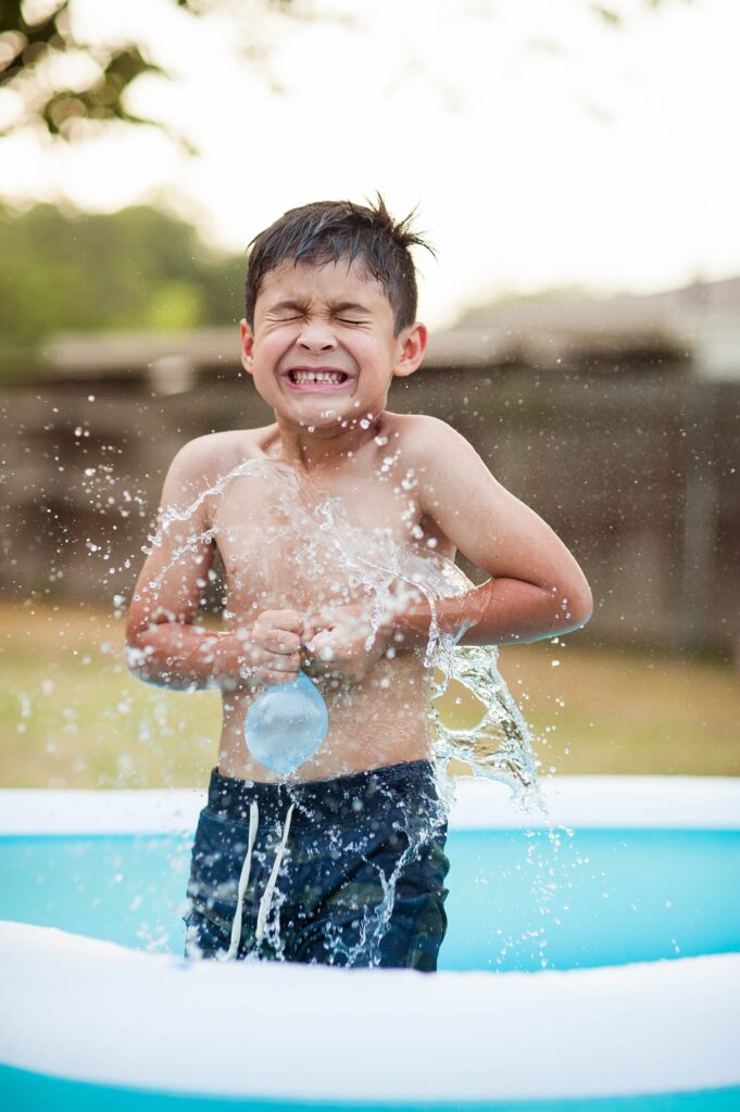 A child cooling off in a splash pool in Texas