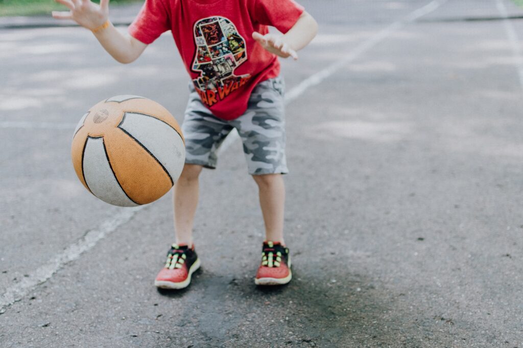A child dribbling a basketball in Carmel, IN