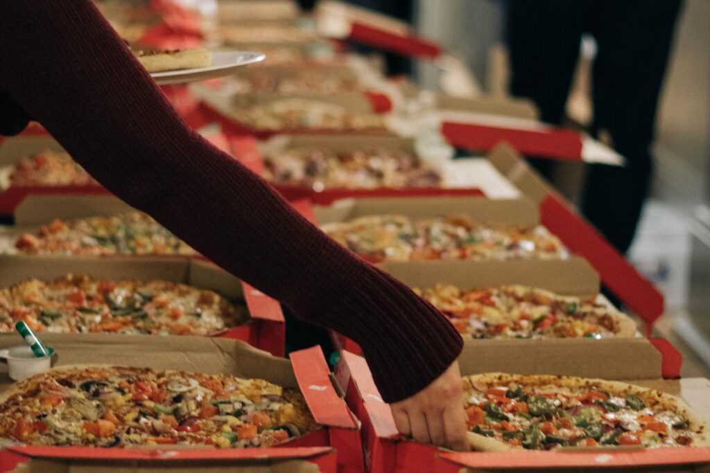 A table full of pizzas at a family party in Alpharetta, GA
