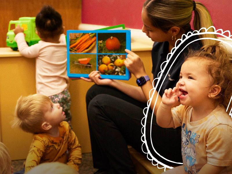 A group of children learning about food from a caregiver at the Crème de la Crème private preschool.