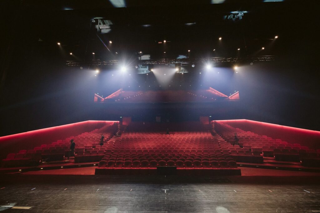 A large empty theater with red seats in Westmont, IL