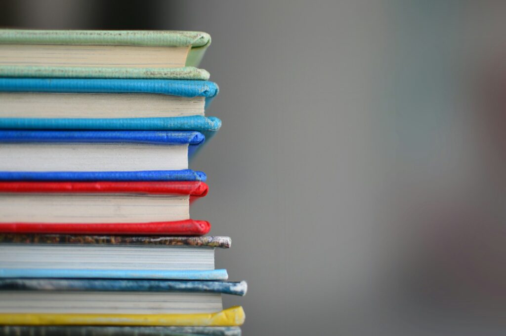 A stack of colorful books at a bookstore in Maple Grove, MN