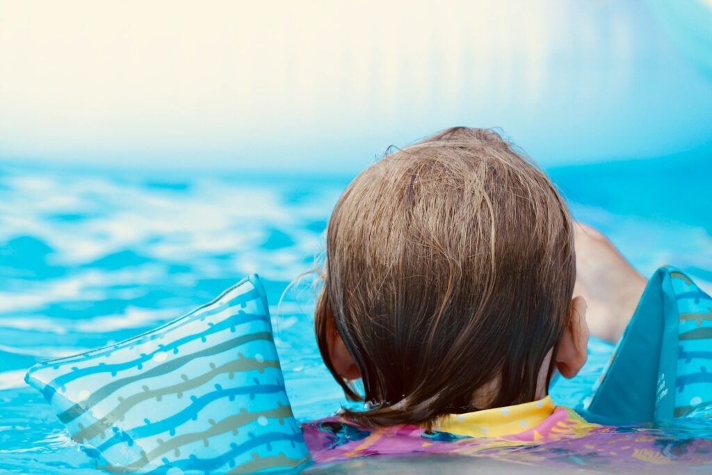 A child at the edge of a pool in Ellisville, MO
