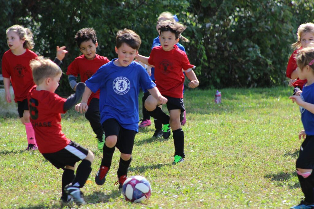 Children playing soccer during a match in Romeoville, IL