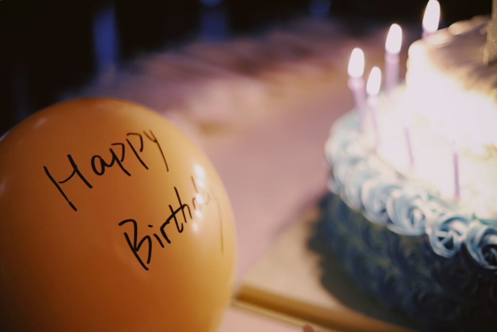 A balloon near a cake at a party venue in Plano, TX