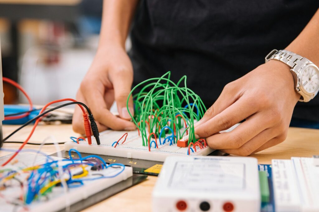 A child working on an electrical science project.
