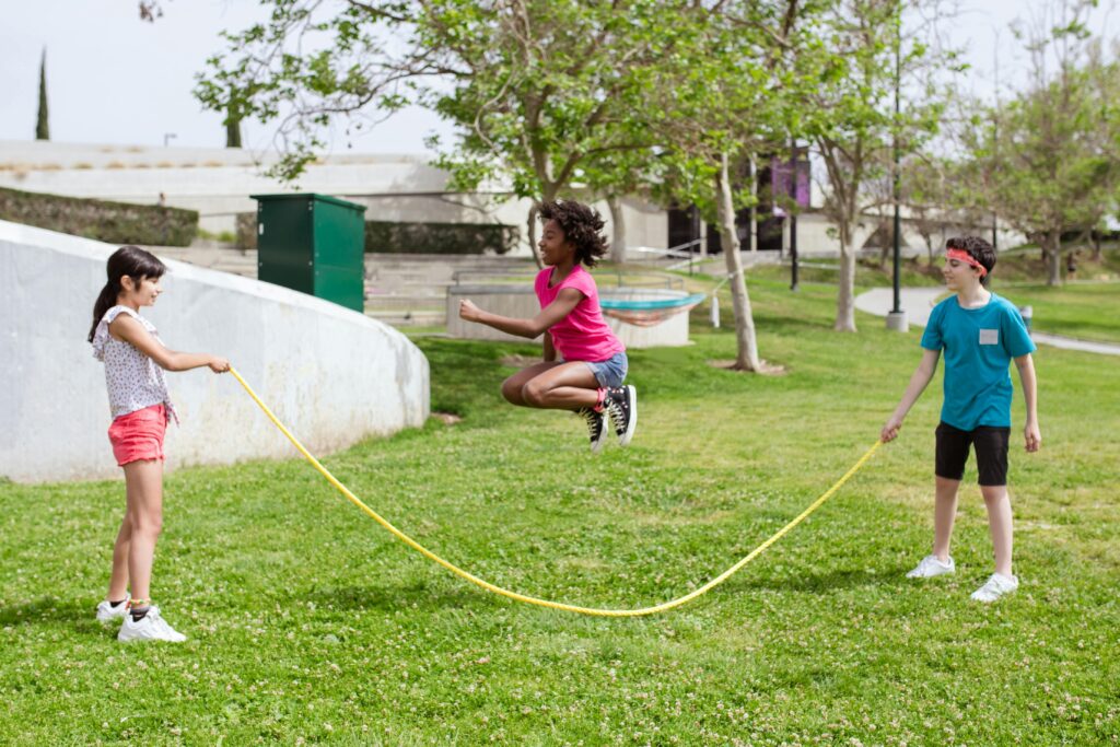 Kids at the park playing jump rope