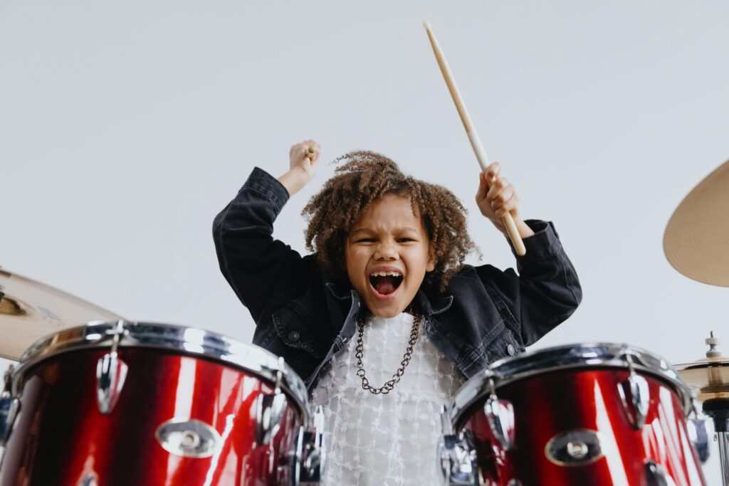 child playing the drums