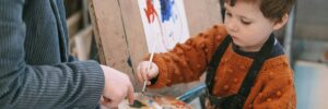 Child painting in art studio