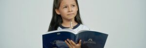 Girl Standing with Book