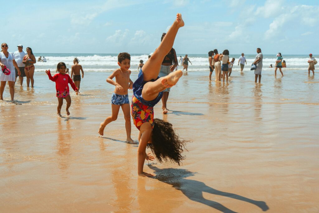 Children Playing on a Sunny Beach Day