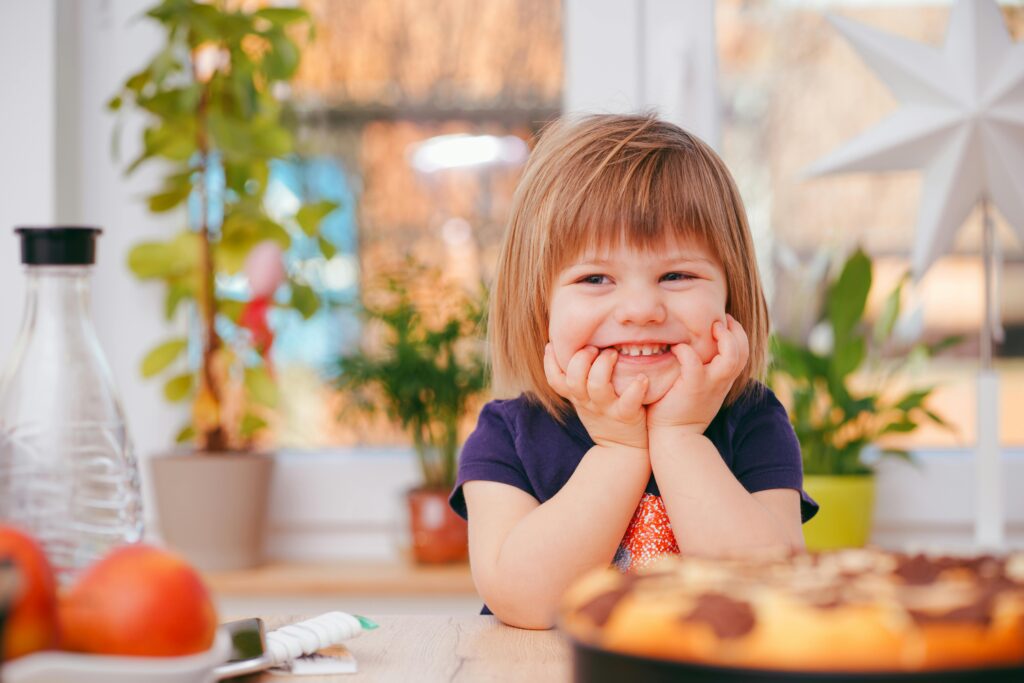 Toddler Smiling at table