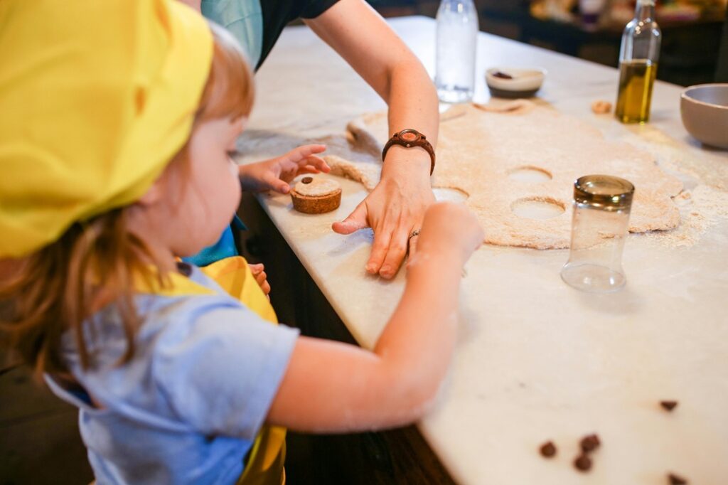 Girl using cookie cutter