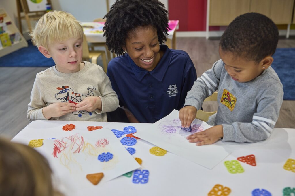Teacher and students doing an art project together