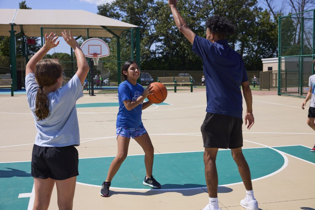 Children playing basketball outdoors
