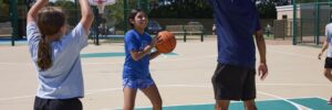 Children playing basketball outdoors
