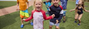 Children playing outdoors at a park in summer