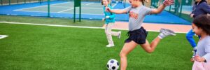 Children playing soccer in a park